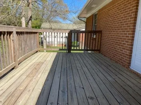 a view of wooden balcony with wooden floor