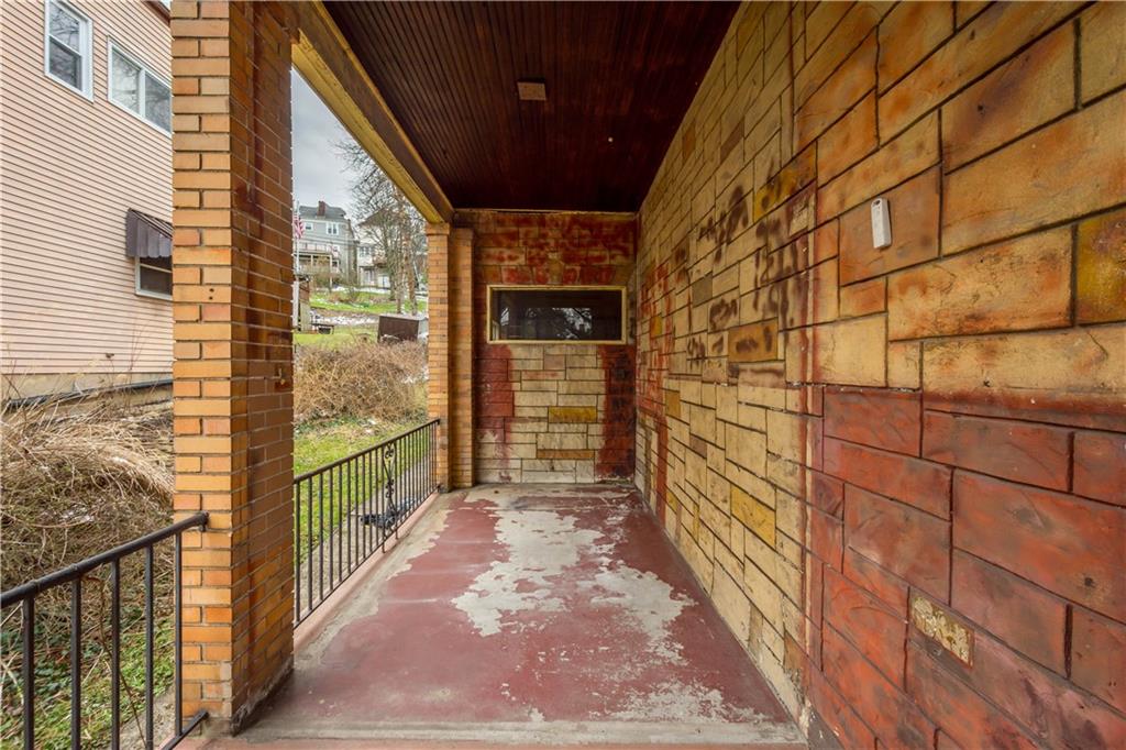 208 Linnview Avenue Pittsburgh, PA 15210 - Photo 12 of 26 a view of a pathway along a building from a balcony