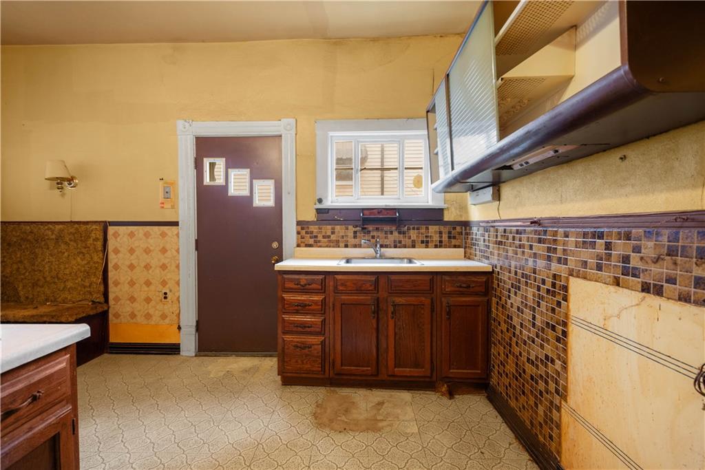 208 Linnview Avenue Pittsburgh, PA 15210 - Photo 19 of 26 a bathroom with a sink and a mirror