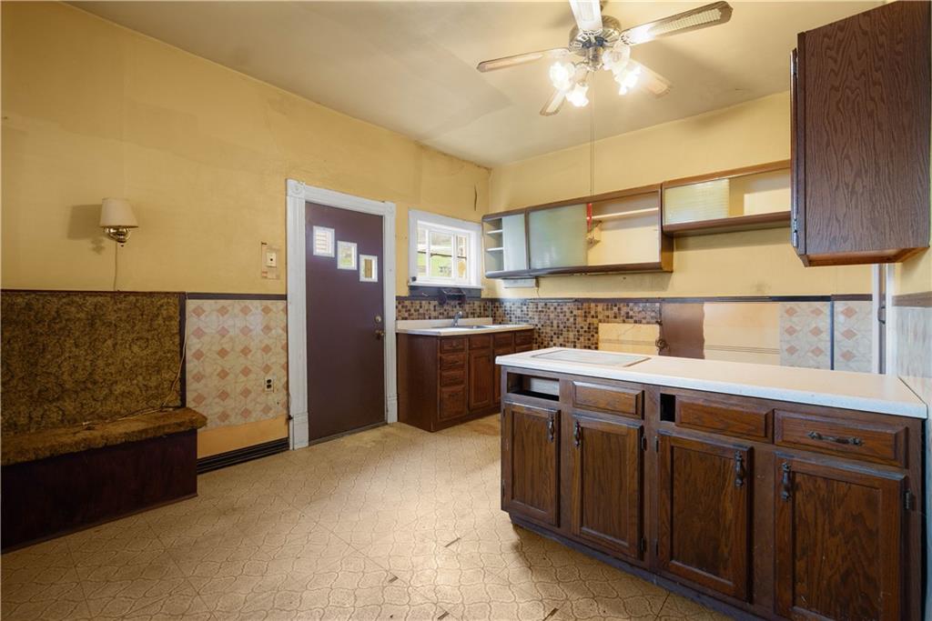 208 Linnview Avenue Pittsburgh, PA 15210 - Photo 22 of 26 a kitchen with a sink cabinets and window