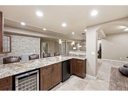 a large bathroom with double vanity and a mirror