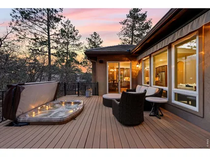 a view of balcony with couch and wooden floor