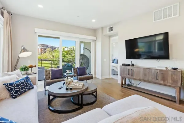a living room with furniture and a flat screen tv
