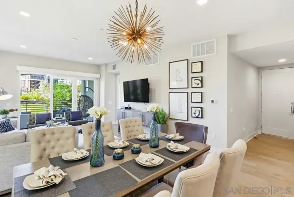 a kitchen with stainless steel appliances kitchen island granite countertop a sink a refrigerator and cabinets