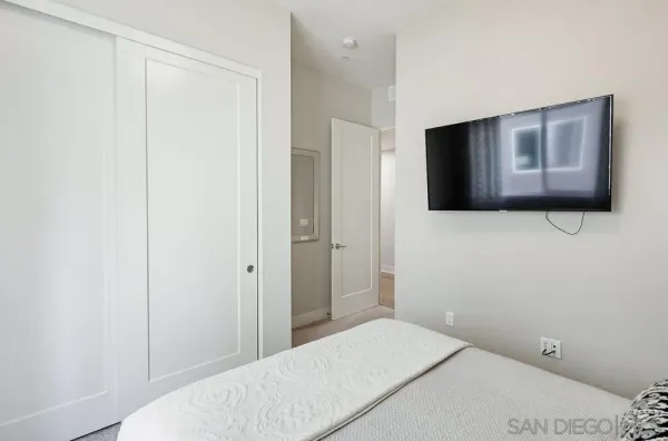 a bedroom with a bed and furniture