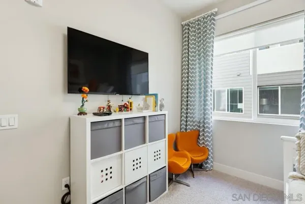a view of a storage and utility room with washer and dryer