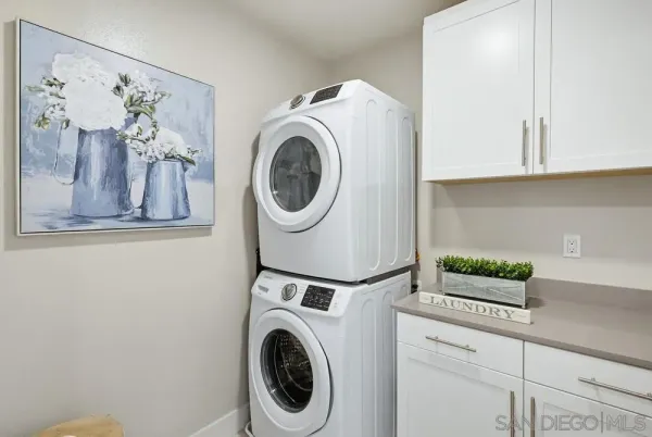 a view of entryway with wooden floor and stairs