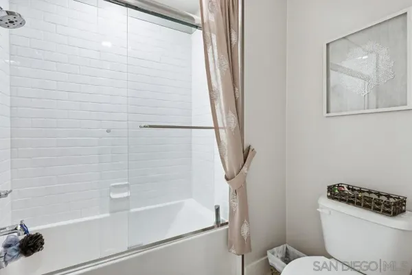 a view of a brick building next to a yard