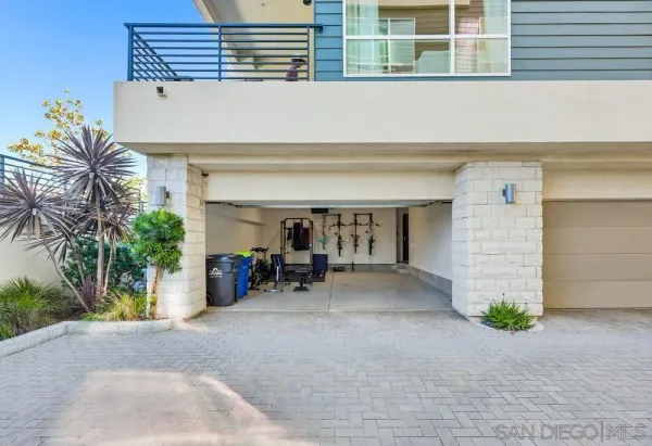 a view of a balcony with wooden floor & fence