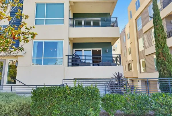 a front view of a building with garden