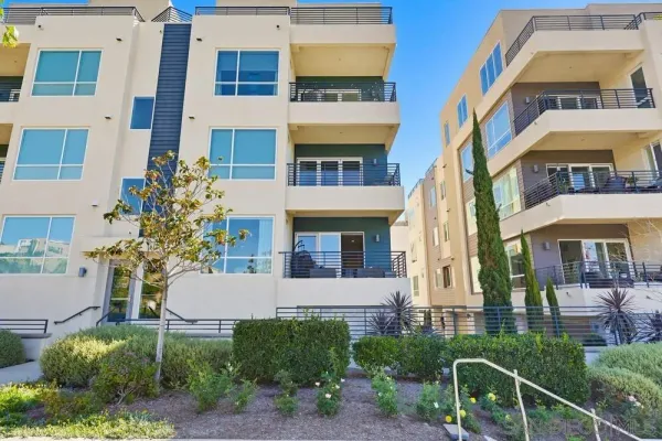 a pathway of a house with a yard