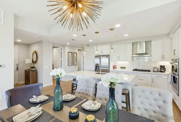 a living room with furniture a rug and a flat screen tv