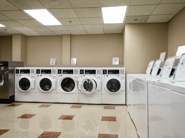a washer and a stove top oven sitting inside of a kitchen