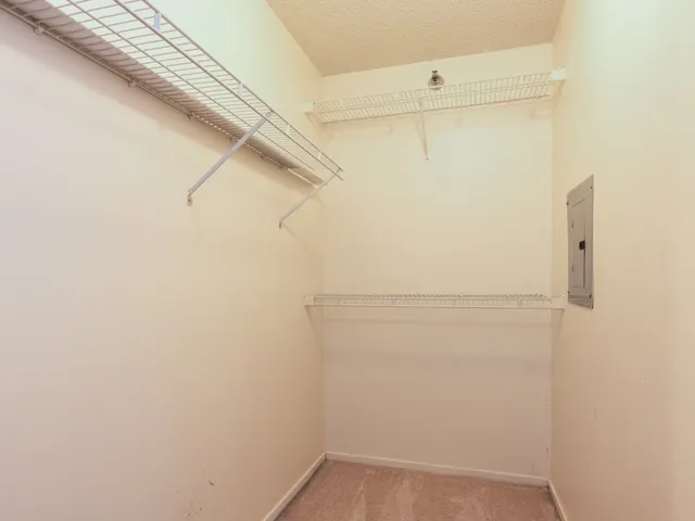 a view of a room with racks on the wall