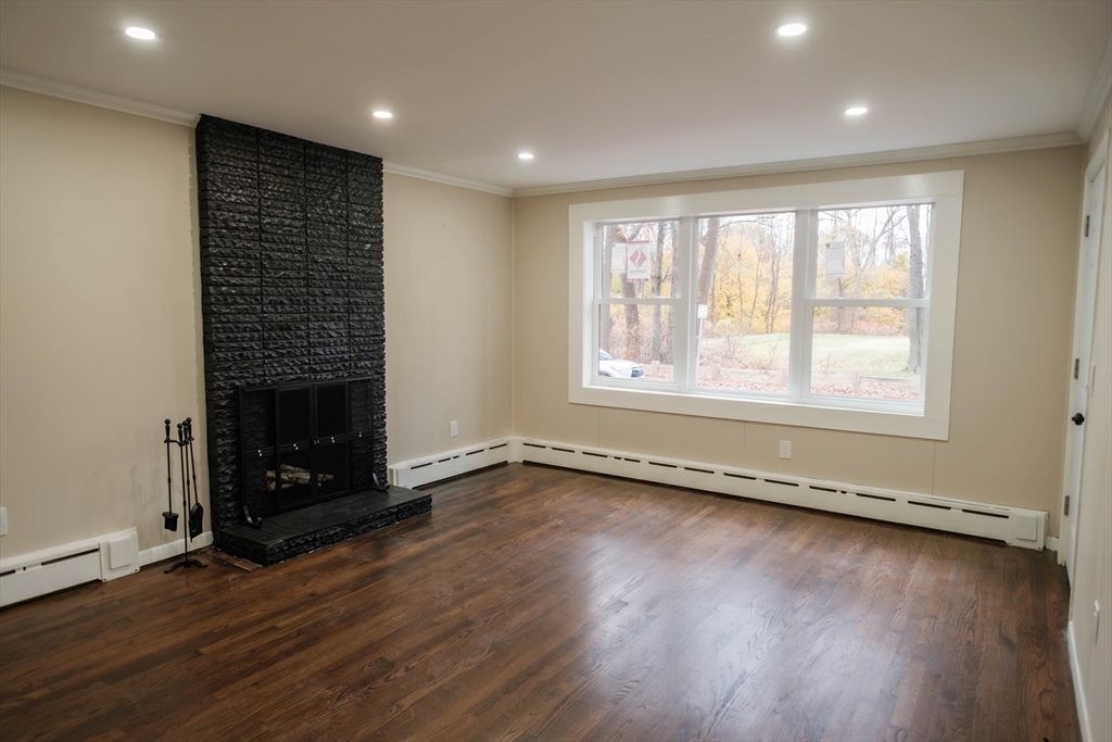 181 Freeman Terrace Springfield, MA 01104 - Photo 16 of 37 an empty room with wooden floor and a window