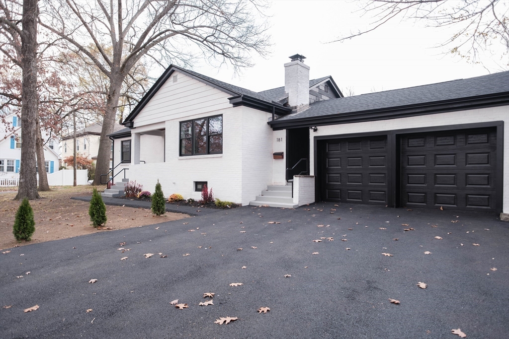 181 Freeman Terrace Springfield, MA 01104 - Photo 2 of 37 a view of a house with a yard and garage