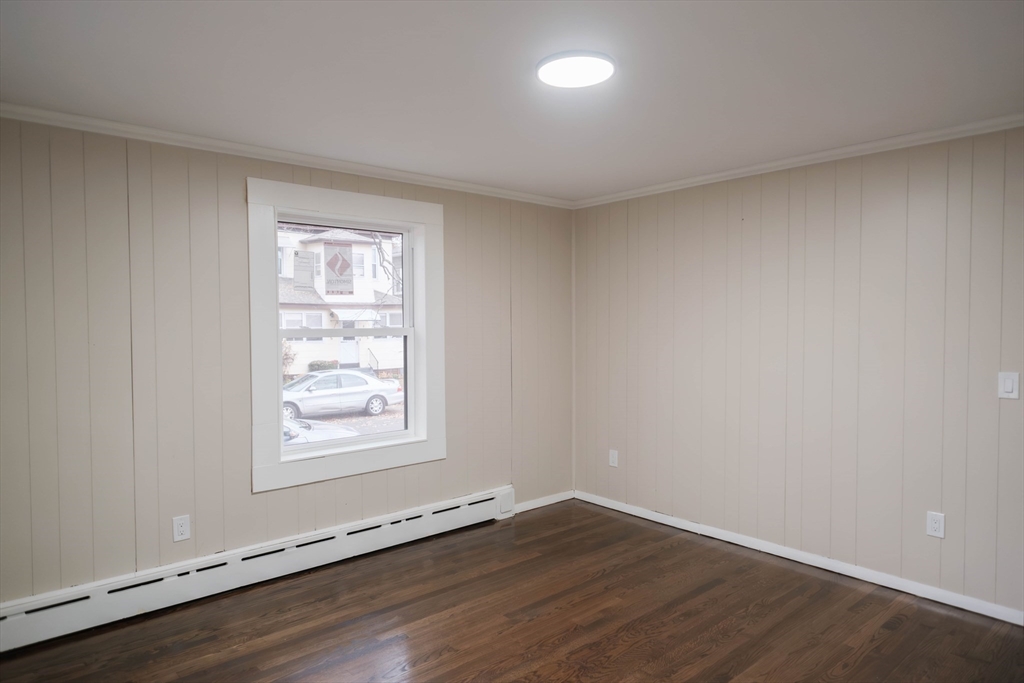 181 Freeman Terrace Springfield, MA 01104 - Photo 29 of 37 an empty room with wooden floor and windows