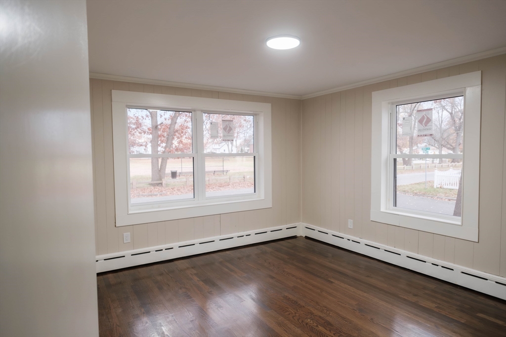 181 Freeman Terrace Springfield, MA 01104 - Photo 30 of 37 an empty room with wooden floor and windows