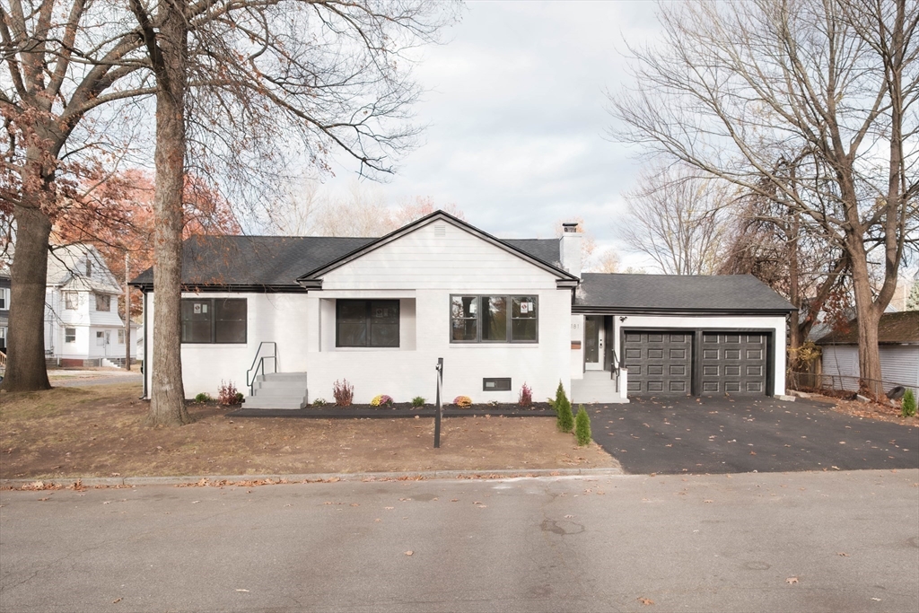 181 Freeman Terrace Springfield, MA 01104 - Photo 3 of 37 a view of a white house with a large tree and plants
