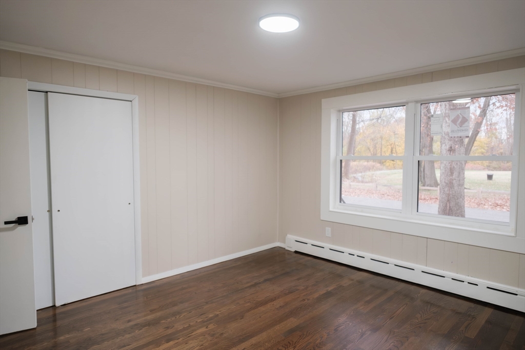 181 Freeman Terrace Springfield, MA 01104 - Photo 31 of 37 an empty room with wooden floor and windows