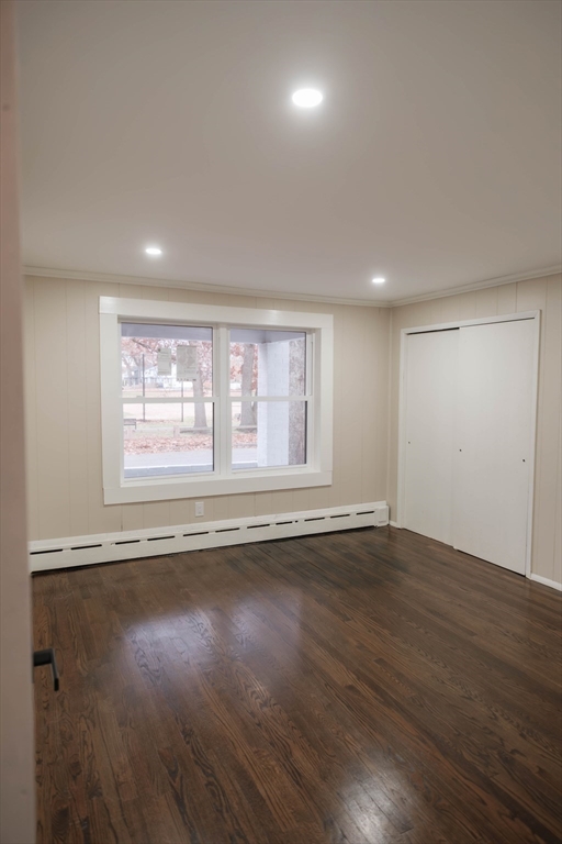 181 Freeman Terrace Springfield, MA 01104 - Photo 33 of 37 an empty room with wooden floor and windows