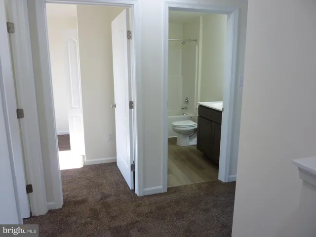 a view of a bathroom with a toilet and a sink