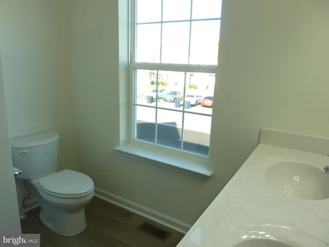 a bathroom with a toilet and a sink
