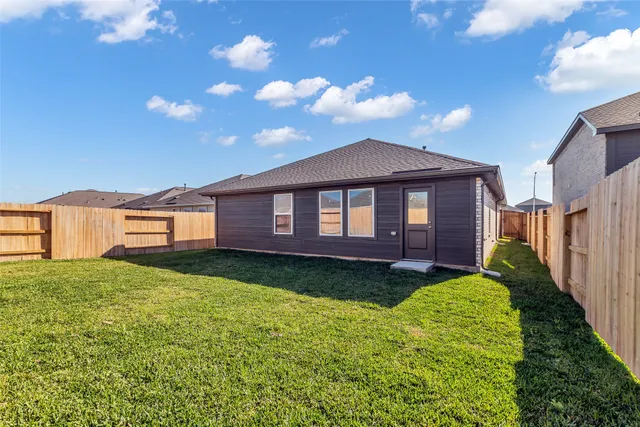 a view of a yard in front of a house with a yard