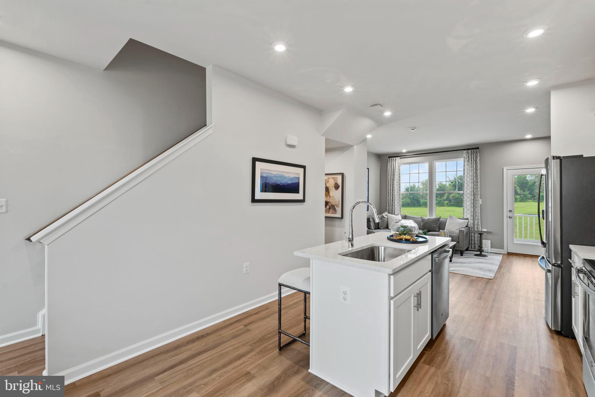 27 Democracy Mews, Unit 468 Ranson, WV 25438 - Photo 60 of 87 Charleston- Kitchen Island staged