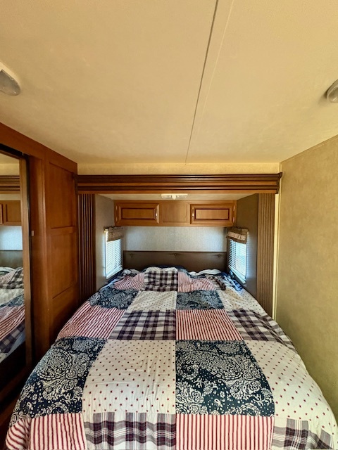 5-308 Woodhaven Sublette, IL 61367 - Photo 17 of 30 a bedroom with a bed and wooden floor