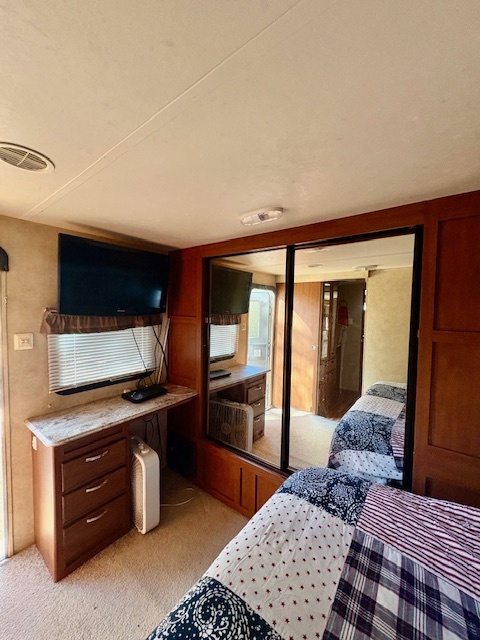 5-308 Woodhaven Sublette, IL 61367 - Photo 19 of 30 a bedroom with a bed and cabinets