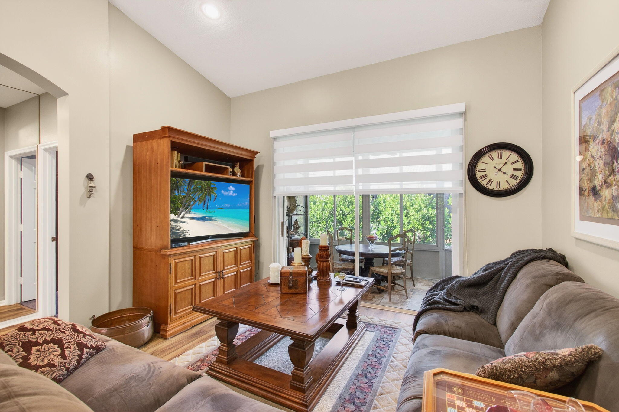 6253 Heliconia Road Delray Beach, FL 33484 - Photo 15 of 85 a living room with furniture a window and a clock