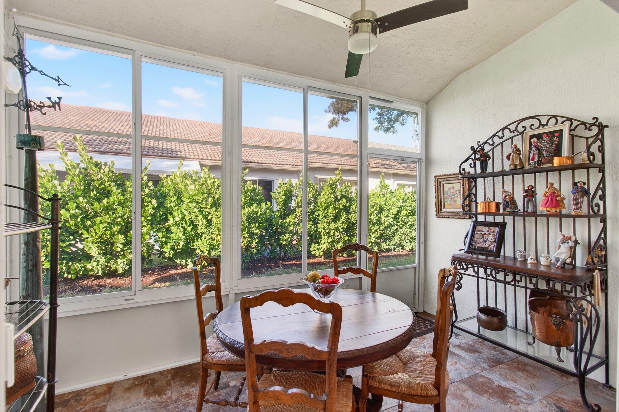 6253 Heliconia Road Delray Beach, FL 33484 - Photo 17 of 85 a dining room with furniture window and wooden floor