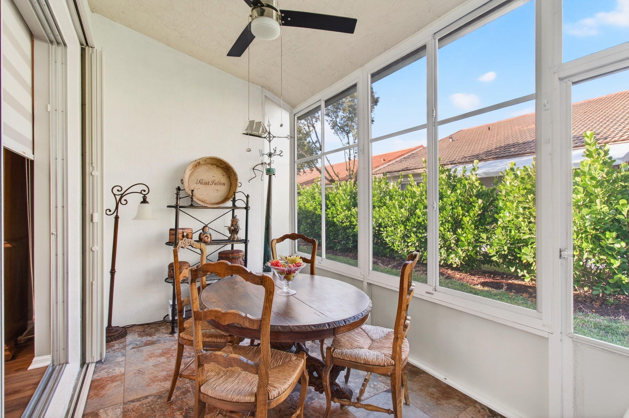 6253 Heliconia Road Delray Beach, FL 33484 - Photo 18 of 85 a view of a dining room with furniture window and outside view