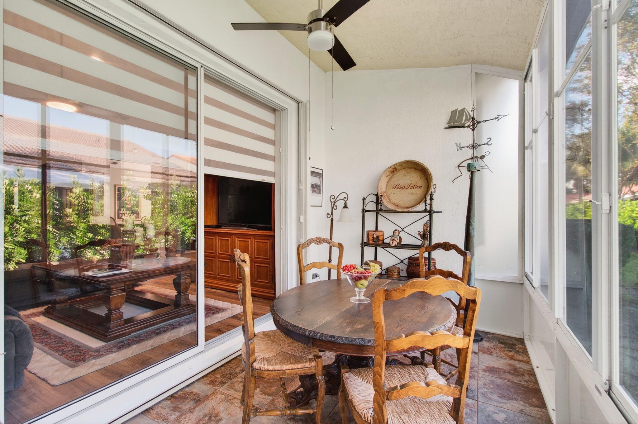 6253 Heliconia Road Delray Beach, FL 33484 - Photo 19 of 85 a view of a dining room with furniture window and wooden floor