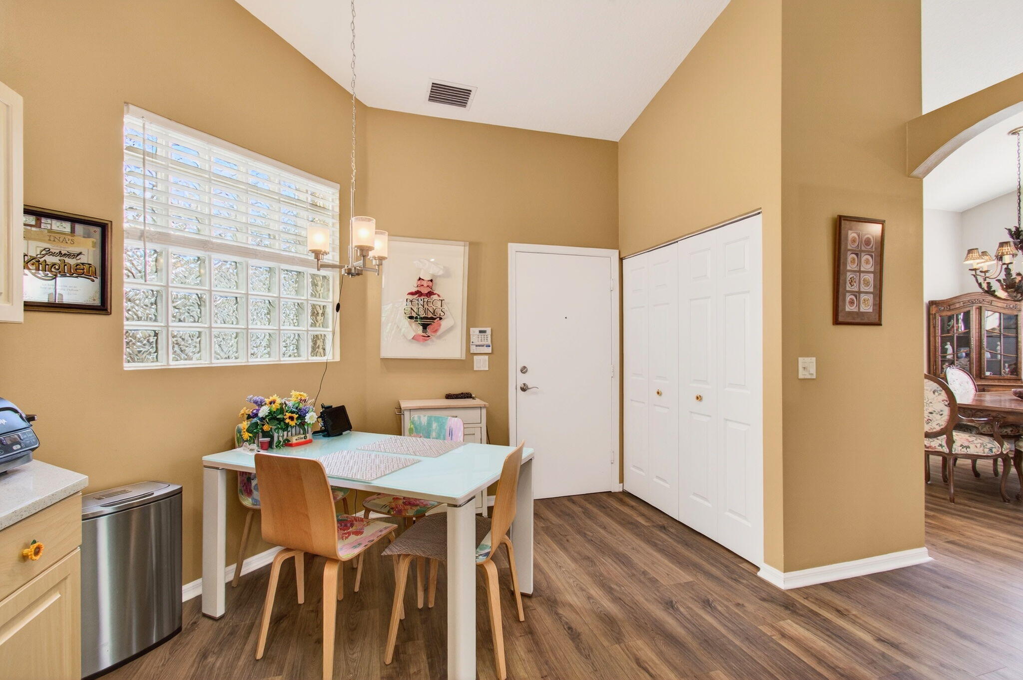 6253 Heliconia Road Delray Beach, FL 33484 - Photo 28 of 85 a view of a dining room with furniture and wooden floor