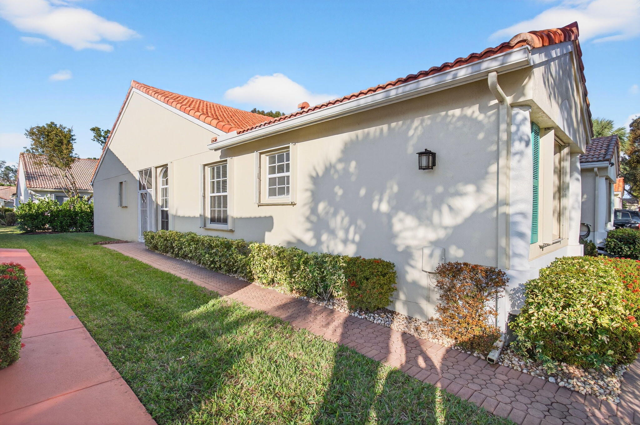 6253 Heliconia Road Delray Beach, FL 33484 - Photo 3 of 85 a front view of a house with a yard