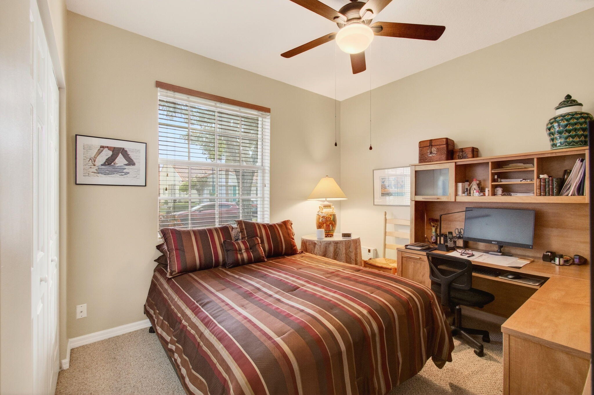 6253 Heliconia Road Delray Beach, FL 33484 - Photo 36 of 85 a bedroom with a bed and a window