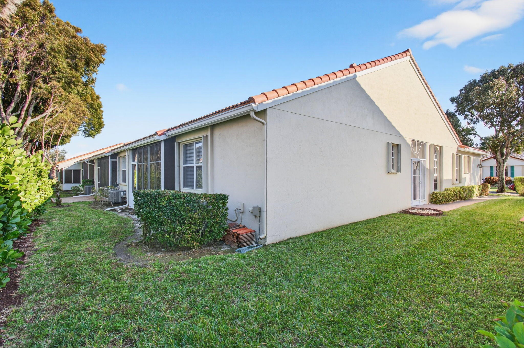 6253 Heliconia Road Delray Beach, FL 33484 - Photo 44 of 85 a view of a house with backyard and garden