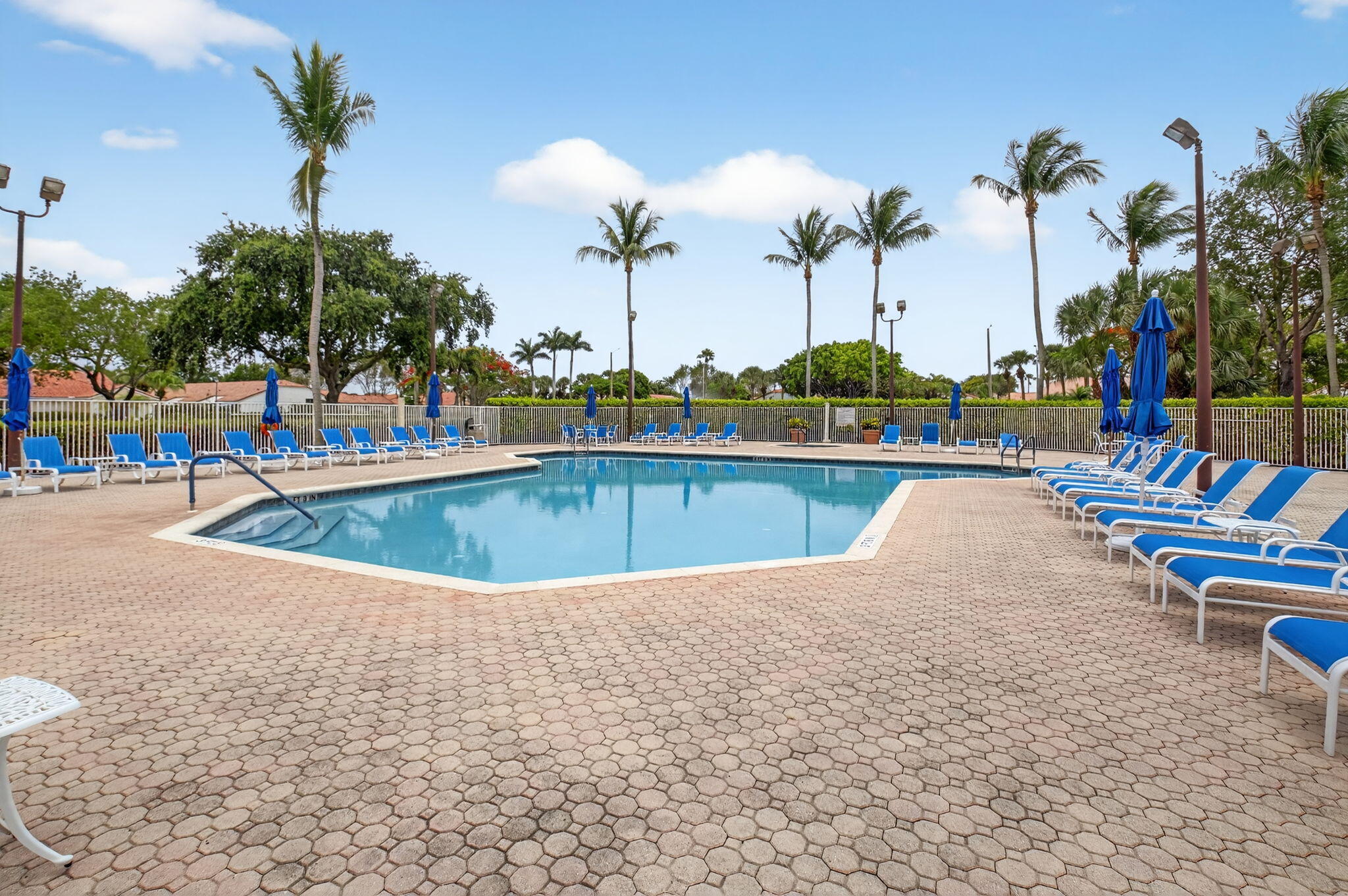 6253 Heliconia Road Delray Beach, FL 33484 - Photo 59 of 85 swimming pool view with a garden space