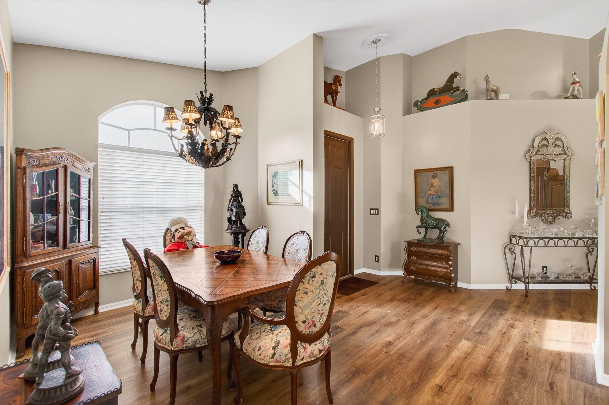 6253 Heliconia Road Delray Beach, FL 33484 - Photo 10 of 85 a view of a dining room with furniture and chandelier