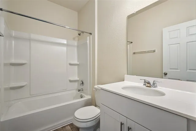a bathroom with a sink toilet and a bathtub