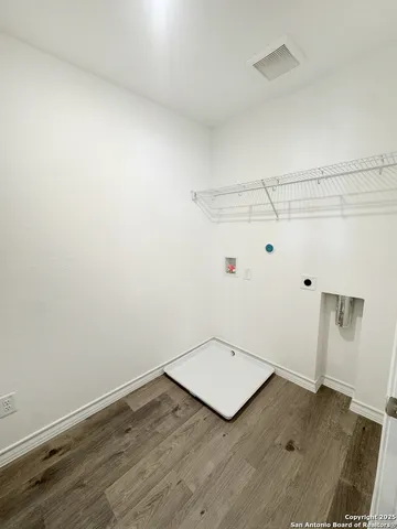 an empty room with wooden floor