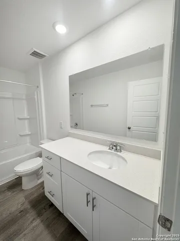 a bathroom with a sink a toilet and a bathtub