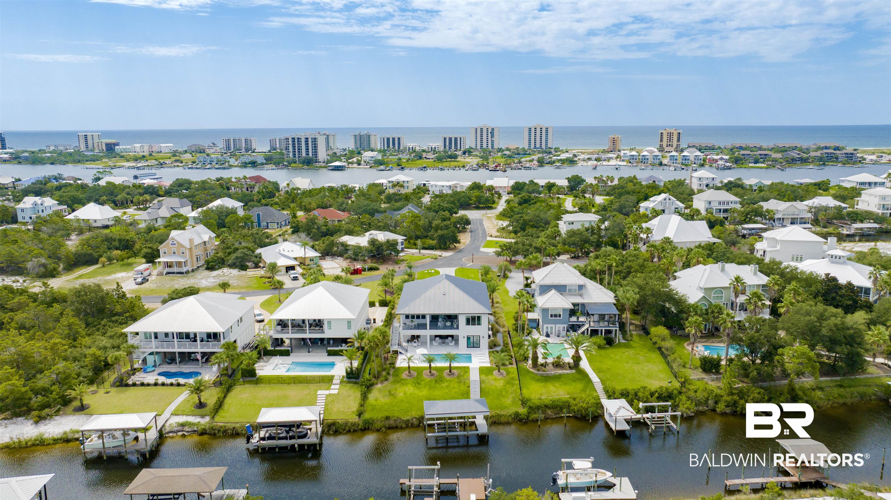 30239 Canal Court Orange Beach, AL 36561 - Photo 68 of 70 Aerial perspective of suburban area featuring a large body of water