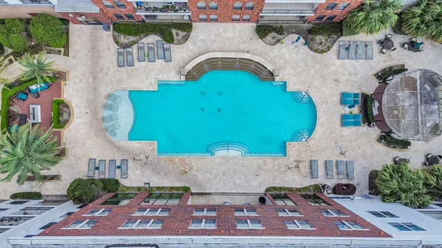 an aerial view of a house with garden space and street view