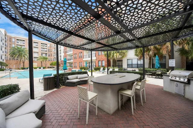 a view of a patio with a dining table and chairs