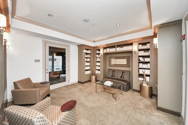 a bedroom with furniture and a chair