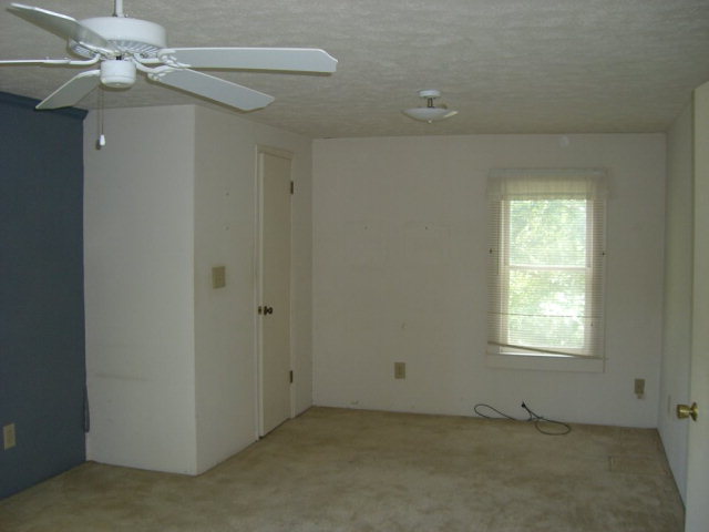 720 Turner Woods Road Gray, GA 31032 - Photo 11 of 22 an empty room with windows and fan