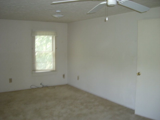 720 Turner Woods Road Gray, GA 31032 - Photo 12 of 22 an empty room with a window